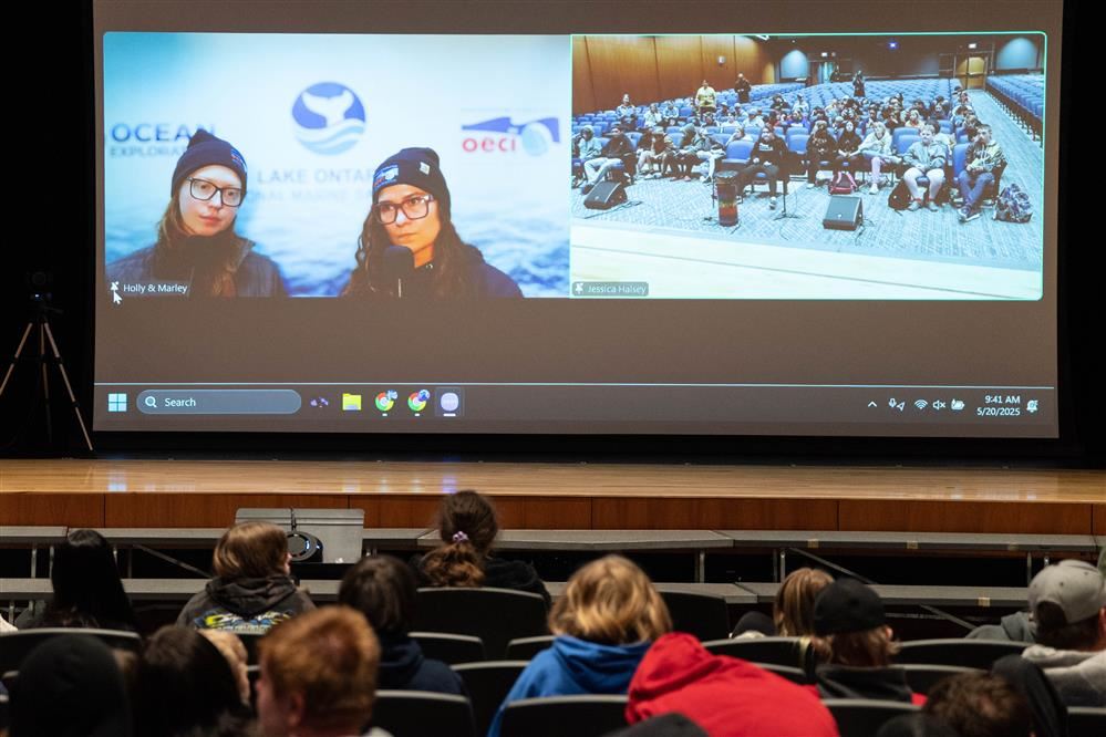  Two members of the NOAA shipwreck research team speak virtually with APW seventh graders, sharing i